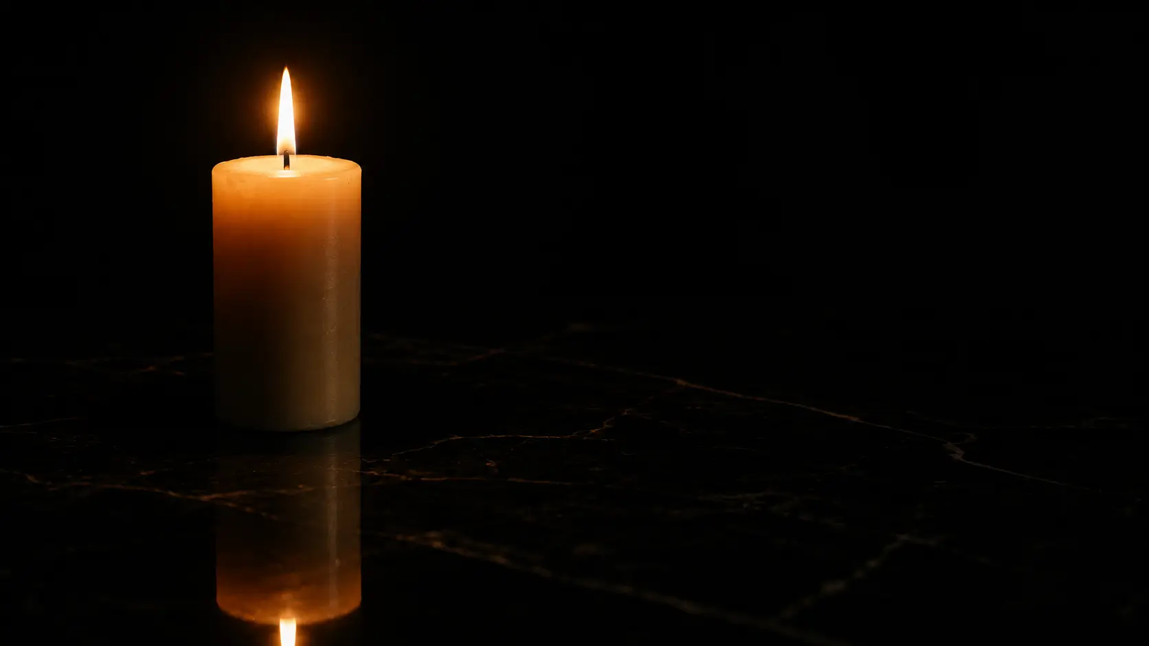 Aquarius man pulls away then returns — a single candle burning on dark marble, the metaphor of contained warmth that never begs to be seen